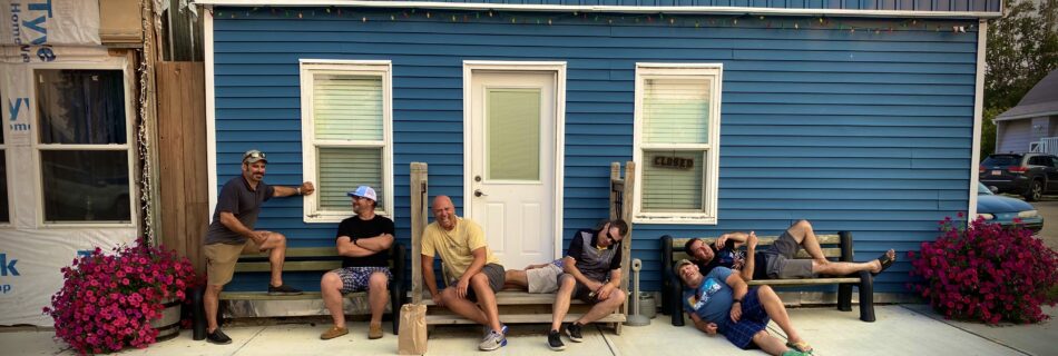 Friends hanging out have a laugh at Rob’s expenses